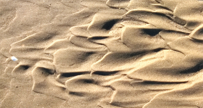 Sand mit Wellen